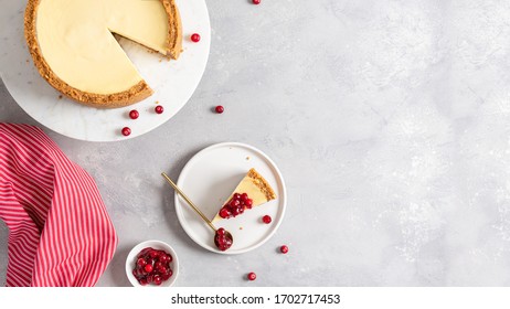 New York Cheesecake Banner. Classic Cheesecake With Cranberry Sauce On Marble Stand And A Piece Of Cake On The Plate. Bakery, Confectionery Banner. Copy Space.