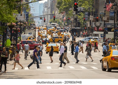 NEW YORK - CIRCA AUGUST 2014: Crowd Of People Pedestrians Walking Crossing Street