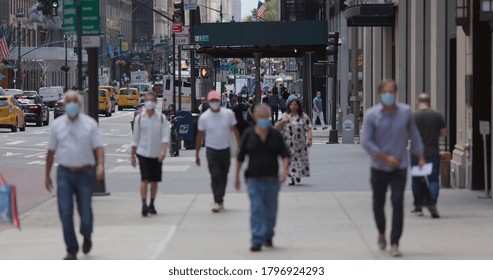 NEW YORK - CIRCA AUGUST 2020: Crowd Of People Wearing A Mask Walking Street During Covid 19 Coronavirus Pandemic