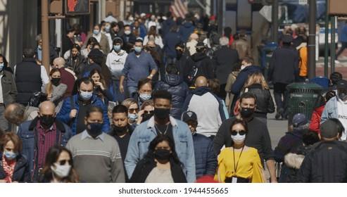 NEW YORK - CIRCA MARCH 2021: Crowd Of People Walking Street Wearing Masks During Covid 19 Pandemic