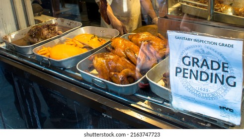 NEW YORK - CIRCA MAY,2014 : Close Up Shot Of Sanitary Inspection Grade On The Window Of A Chinatown Restaurant. 