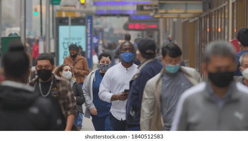 NEW YORK - CIRCA OCTOBER 2020: Crowd Of People Walking Street Wearing Masks During Coronavirus Pandemic