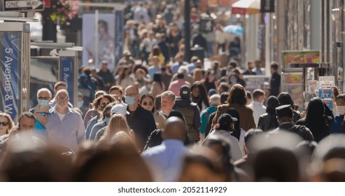 NEW YORK - CIRCA SEPTEMBER 2021: Crowd of people walking street some wearing masks during Covid 19 pandemic - Shutterstock ID 2052114929