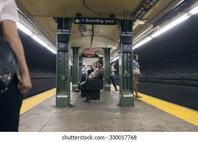 new york city, 11 september 2015: passengers wait on platform of subway station jay street metro tech in new york city