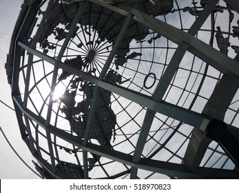 NEW YORK CITY - 22 April 2014:  Sun shining through the Unisphere, the site of the 1964-65 World's Fair in New York.  Corona Park, Flushing, Queens.