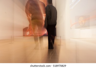 NEW YORK CITY - 22 FEBRUARY 2011:  Two Men Standing Inside The MoMA Looking At 