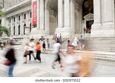 New York City - 29 July 2017: Motion Blur From Slow Shutter Speed Walking Up The Steps To The Front Entrance Of The Main Branch Of The New York Public Library On Fifth Avenue In New York City.