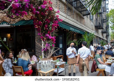 New York City - April 18 2021: Busy Outdoor Restaurant During Covid Outbreak. Restaurants Started Serving Meals Outdoors Due To Pandemic Dining Rules.