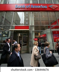 NEW YORK CITY - APRIL 19: Pedestrians walk past a Bank of America branch office  in New York City, on Friday, April 19, 2013.