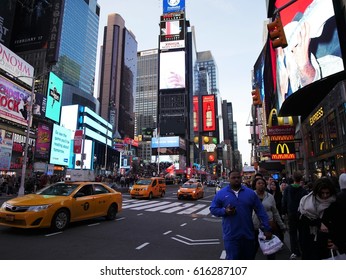 New York City - April 2 2017. Time Square, the crossroad of the world with crowds of people, street full of traffic and billboards. - Shutterstock ID 616287107