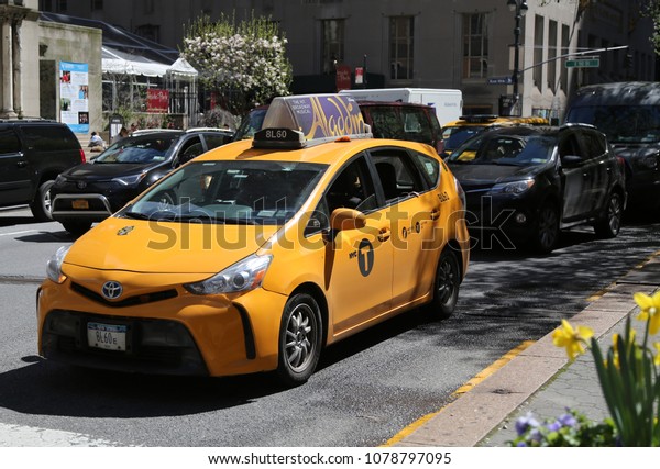 NEW YORK CITY - APRIL 26, 2018: New York City\
Taxi in Manhattan. New York City has around 6,000 hybrid taxis,\
representing almost 45 of the taxis in service, the most in any\
city in North America