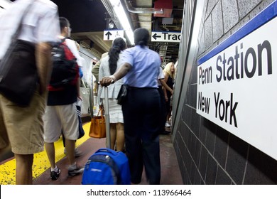 NEW YORK CITY - AUG 29:  Commuters Bustle On The Long Island Railroad Subway Platform At Pennsylvania Station NYC On Aug. 29, 2012.  Penn Station Is A Train Major Hub Serving 300,000 Commuters A Day.