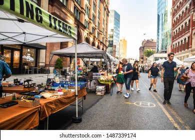 NEW YORK CITY - AUGUST 24, 2019:  View of tent street fair at Astor Place in Manhattan with people visible.