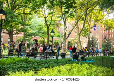 NEW YORK CITY - AUGUST 24, 2019:  View from Washington Square Park in Greenwich Village Manhattan on a summer afternoon.  People and NYU are visible.