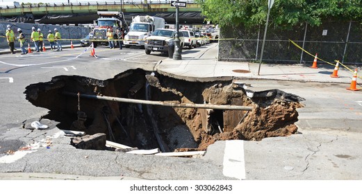 NEW YORK CITY - AUGUST 4 2015: a massive sinkhole erupted in the Sunset Park neighborhood of Brooklyn, closing several streets & bringing FDNY, OEM & DEP, Con Ed & National Grid.