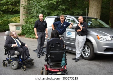 NEW YORK CITY - AUGUST 5 2015: The 2015 Sapolin Awards Were Given Out During A Banquet At The Bronx Zoo On The 25th Anniversary Of The ADA. Bussani Mobility Team Shows New Accessible Vehicle