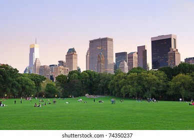 New York City Central Park at dusk panorama with Manhattan skyline and skyscrapers.