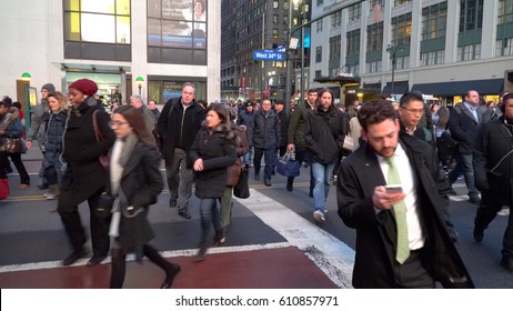 New York City - Circa 2017: Crosswalk Sign Change Stop Hand To Walk Signal, Mob Crowd Of Busy Commuting People Rush Across Manhattan Street Traffic Intersection To Penn Station Traveling Home On LIRR.