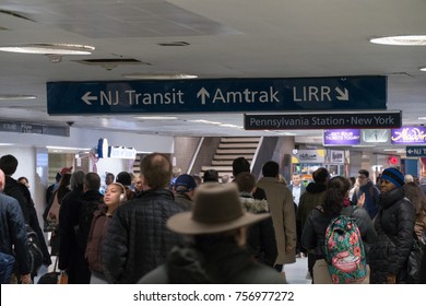 New York City, Circa 2017: Penn Station Crowd During Rush Hour Walking Through Cooridor Under Sign For New Jersey Transit Amtrak Long Island Railroad Trains