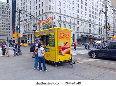 NEW YORK CITY CIRCA OCTOBER 2017. Food Cart Operators Such As This Hot Dog Vendor Compete Heavily For Top Spots Near Popular Tourist Hubs Which Can Many Times As Lucrative As Quieter Locations.