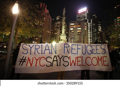 NEW YORK CITY - DECEMBER 10 2015: The Arab-American Association of NY sponsored a rally in Columbus Circle denouncing anti-immigrant xenophobia. Syrian refugees welcome banner