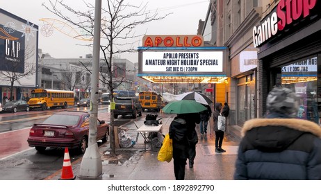 NEW YORK CITY - DECEMBER 2018: Harlem Streets On A Rainy Day With People And Traffic. Slow Motion