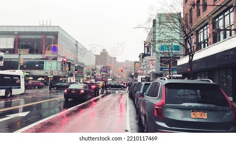 NEW YORK CITY - DECEMBER 2018: Harlem Streets On A Rainy Day With People And Traffic. Slow Motion