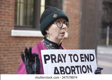 NEW YORK CITY - DECEMBER 5 2015: Planned Parenthood National Day of Solidarity marked by a solitary protester who calls herself Maryanne D. in vigil outside the Planned Parenthood clinic on Bleeker St