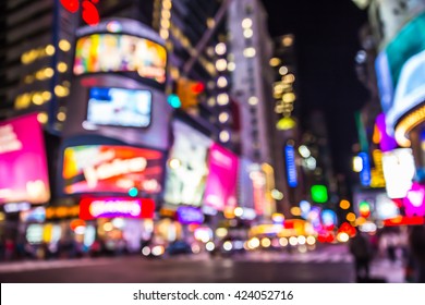 New York City defocused blur of Times Square lit up at night