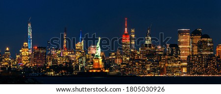 New York City downtown skyline at night with architecture