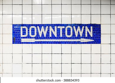 New York City Downtown subway station with mosaic sign with arrow. New York City, USA name tile pattern in subway station, metropolitan.