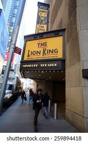 NEW YORK CITY - FEB. 25, 2015:  Pedestrians Walk Past The Minskoff Theater, Home Of Disney's Broadway Play, The Lion King. 

