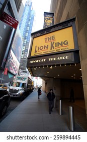 NEW YORK CITY - FEB. 25, 2015:  Pedestrians Walk Past The Minskoff Theater, Home Of Disney's Broadway Play, The Lion King. 

