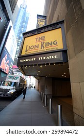 NEW YORK CITY - FEB. 25, 2015:  Pedestrians Walk Past The Minskoff Theater, Home Of Disney's Broadway Play, The Lion King. 

