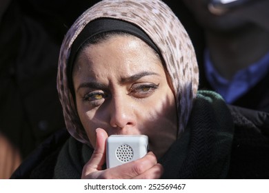 NEW YORK CITY - FEBRUARY 13 2015: Members Of The Muslim Community Staged A Vigil To Call For Justice In The Killing Of Three Muslim Chapel Hill Students. Female Activist Addresses Rally