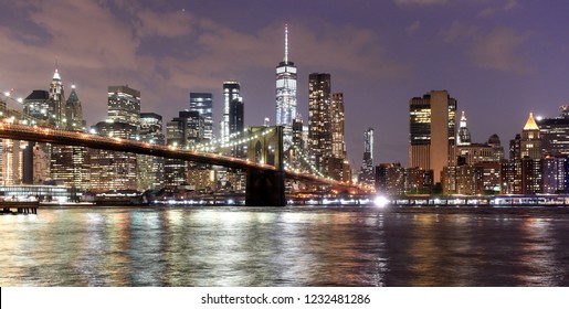 New York City, Financial District In Lower Manhattan With Brooklin Bridge At Night, USA