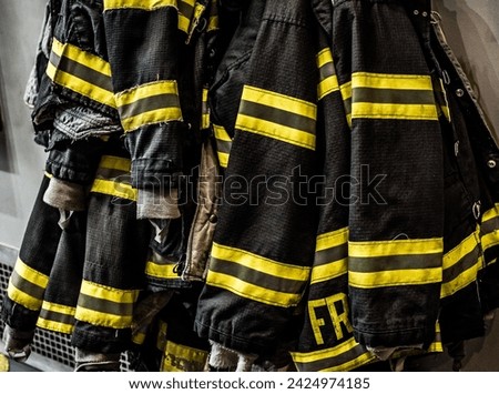 New York City Fireman coats hanging in firehouse