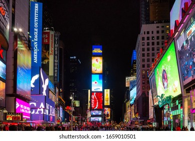 NEW YORK CITY - JAN 13: A Crowded Times Square, Featured With Broadway Theaters And Animated LED Signs On January 13, 2013. Times Square Holds The Annual New Year's Eve Ball Drop.