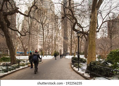 NEW YORK CITY - JAN. 31, 2014:  Cold Winter Scene In Madison Square Park In Midtown Manhattan With Pedestrians And The Flatiron Building Visible.  