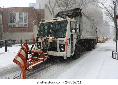 NEW YORK CITY - JANUARY 26 2015: Brooklyn Heights Residents Gird Themselves In Preparation For Winter Storm, Juno, The First Major Blizzard Of 2015. Dept Of Sanitation Truck With Snowplow