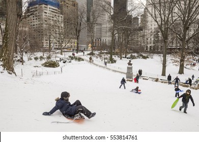 NEW YORK CITY - JANUARY 8, 2016: New Yorkers gather with sleds on a slope in Central Park to take advantage of an overnight snowstorm.