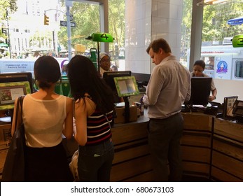 NEW YORK CITY - JULY 18, 2017: Whole Foods Market (WFM). Customer Man Buys At Register From Employee. The American Supermarket Chain Acquired By Amazon (AMZN), Expanding Presence As Physical Retailer.