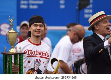 NEW YORK CITY - JULY 4 2015: Nathan's Famous Held Its Annual Fourth Of July Hot Dog Eating Contest In Coney Island, Brooklyn. Winner Matt Stonie With Trophy