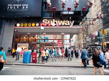 NEW YORK CITY - JUN 26: Times Square Subway Station In NYC On June 26, 2012. Times Square Is A Busy Tourist Intersection Of Commerce Advertisements And A Famous Street Of New York City And US.