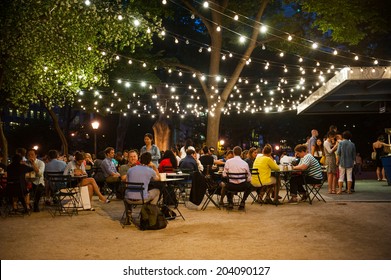 NEW YORK CITY - June 10: Customers Dine At Shake Shack In Madison Square Park June 10, 2014 In New York, NY. The Chain Diner Opened In 2004 And The Madison Square Park Location Is The Original.