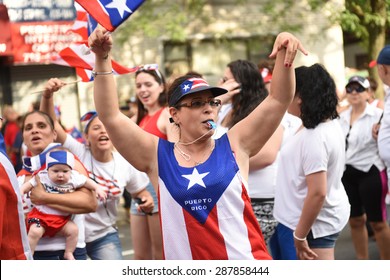 NEW YORK CITY - JUNE 14 2015: The First Sunset Park Puerto Rico Day Parade In Three Decades Was Held Along 5th Avenue In Brooklyn Late In The Evening To Permit Attendance At The Manhattan Parade