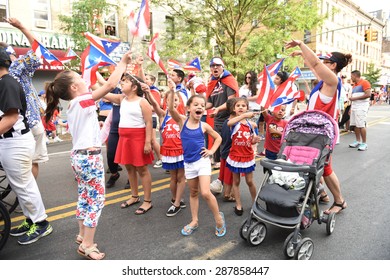 NEW YORK CITY - JUNE 14 2015: The First Sunset Park Puerto Rico Day Parade In Three Decades Was Held Along 5th Avenue In Brooklyn Late In The Evening To Permit Attendance At The Manhattan Parade