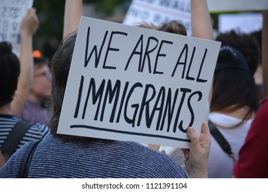 New York City, June 26, 2018 - People holding signs protesting the Supreme Court's decision to uphold Donald Trump's Muslim Travel Ban in Manhattan. - Shutterstock ID 1121391104