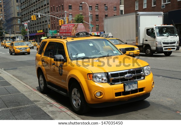 NEW YORK CITY - JUNE 27: New York City Taxi on\
June 27, 2013. New York City has around 6,000 hybrid taxis,\
representing almost 45% of the taxis in service. the most in any\
city in North America