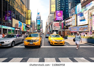 NEW YORK CITY - JUNE 28: Times Square Is A Busy Tourist Intersection Of Commerce Advertisements And A Famous Street Of New York City And US, Seen On June 28, 2012 In New York, NY.